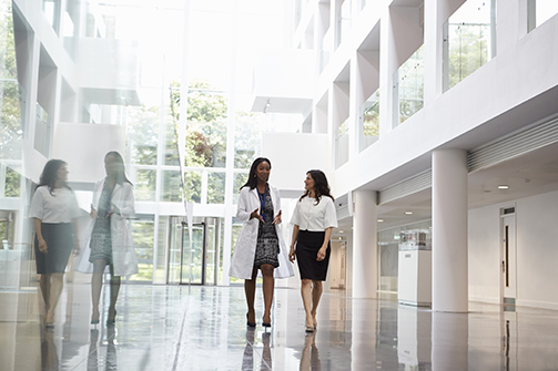 Female Doctors Talking As They Walk Through Hospital Inspirien is set apart by our customer relationships.